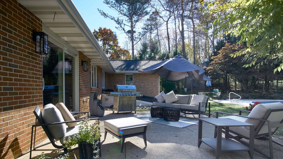 Backyard Patio with Gas Grill and Seating Area