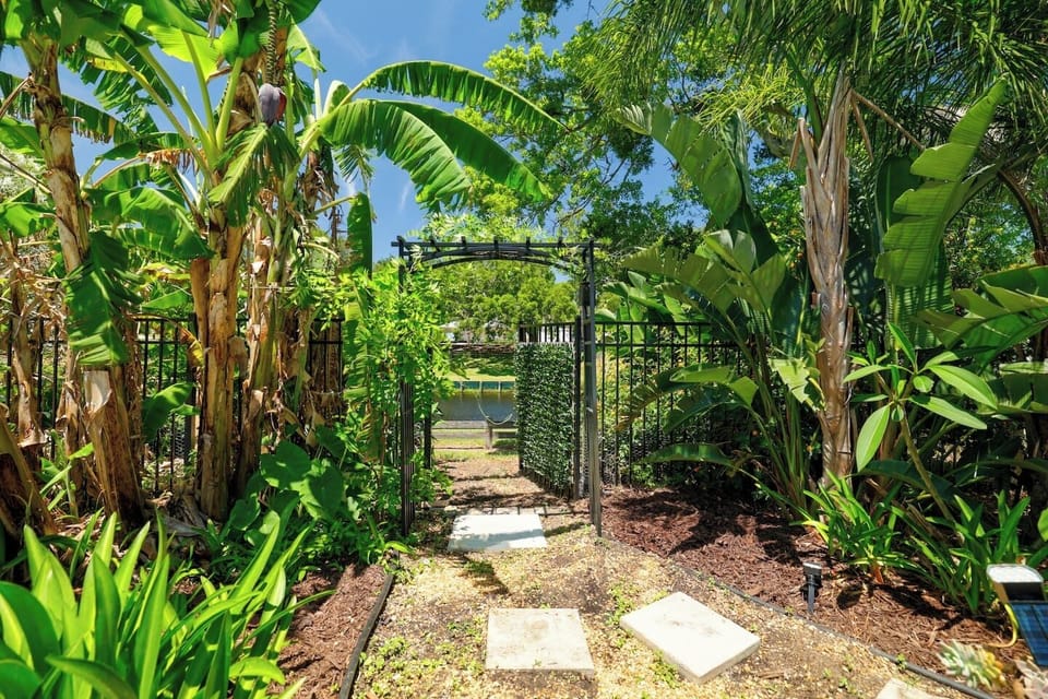 The back gate exits to a park with a playground just down the walkway.