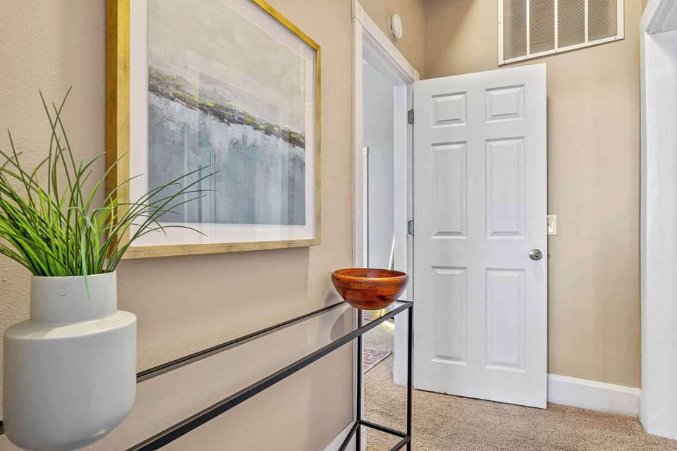 Hallway off the dining room and leads you to the glam room and our king bedroom.