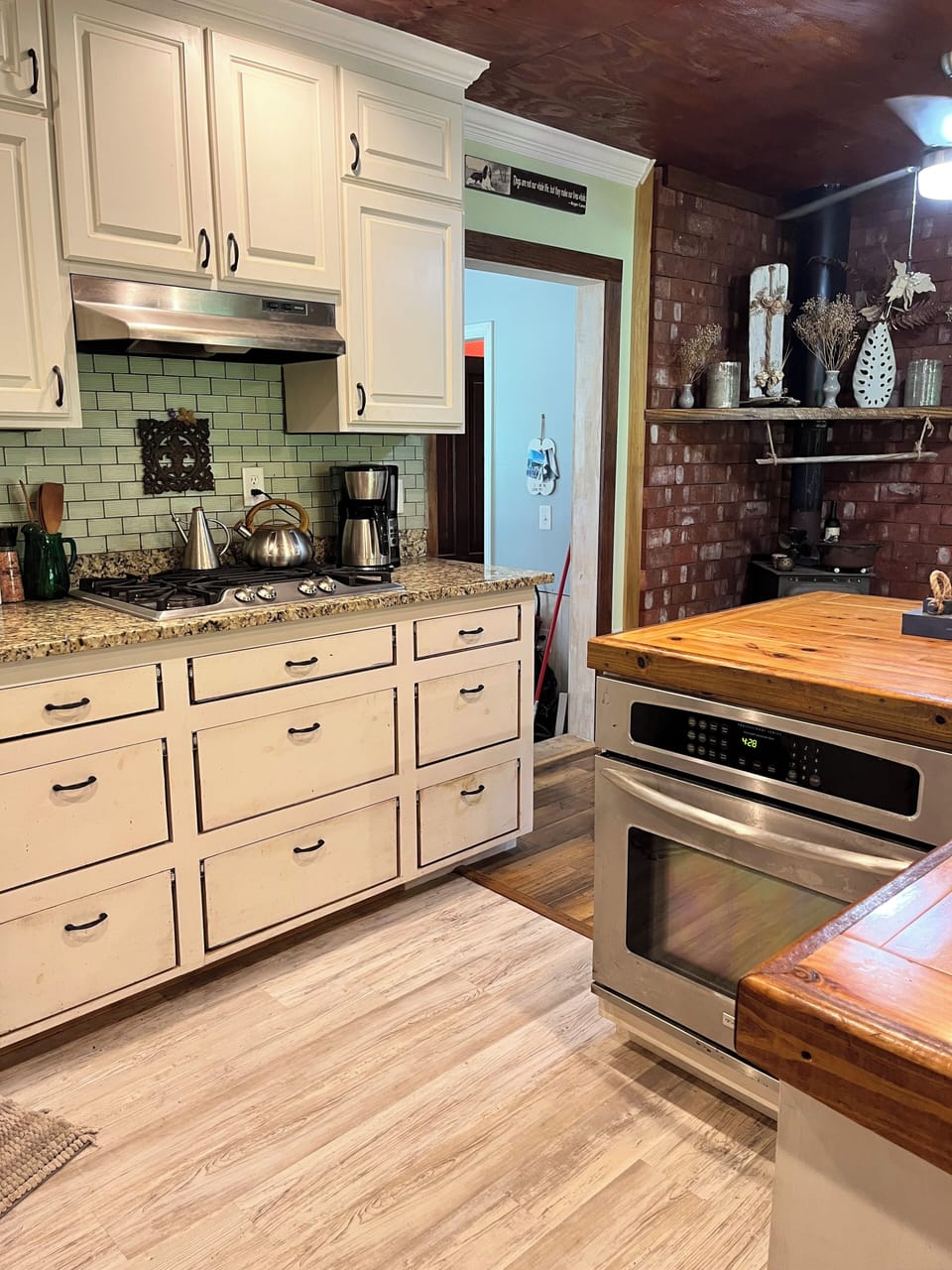 Full kitchen with stove, oven, and all pots/ pans/ dishes guest would need.