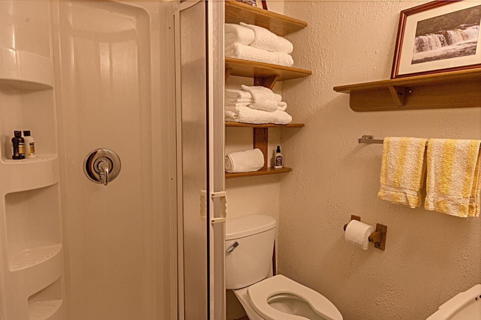 Off the kitchen, there's a full bathroom with a standup shower.