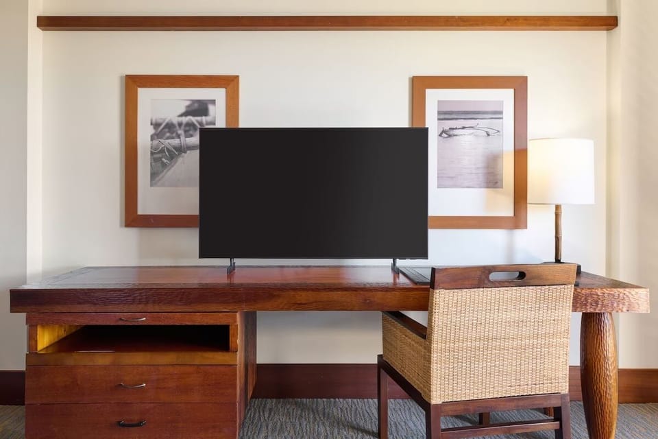 Settle in with a dedicated desk and large-screen entertainment.