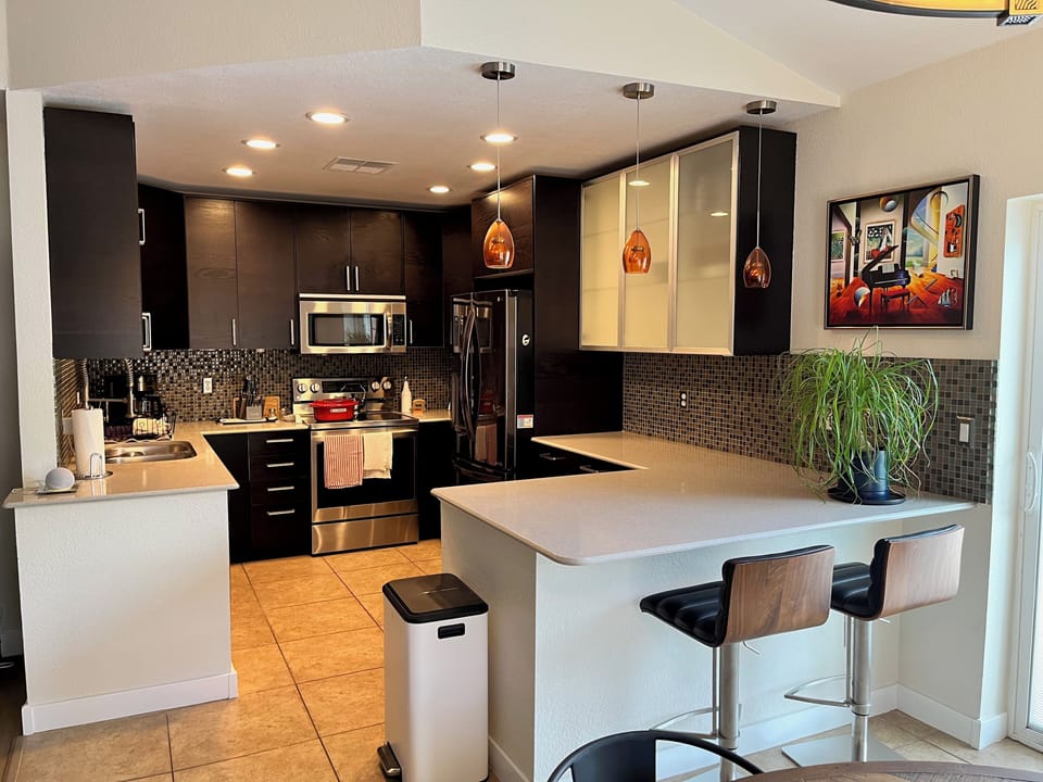 Our kitchen offers a small island for sitting in addition to the kitchen table. 