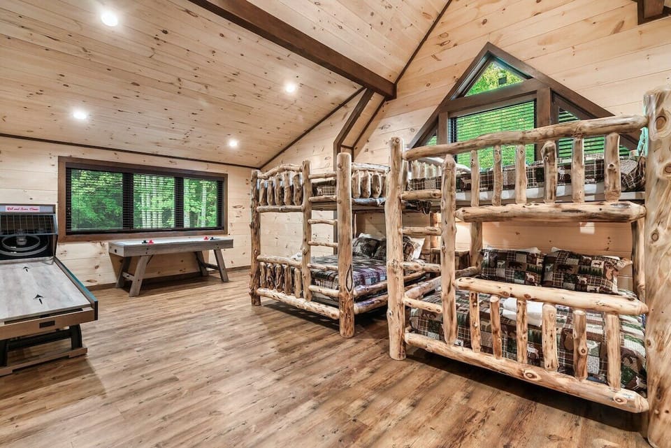 Line up for skee-ball, challenge someone to air hockey, and let the afternoon disappear, pine walls, big forest window. Feels like a real rec room.