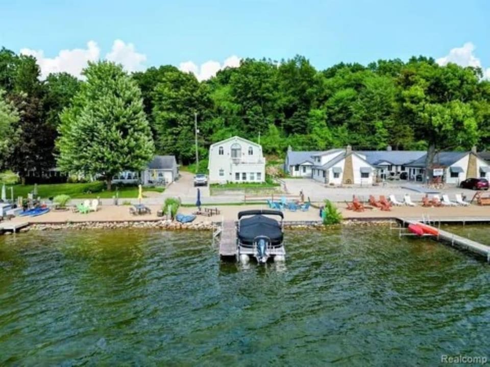 View of dock and house, boat is not available.