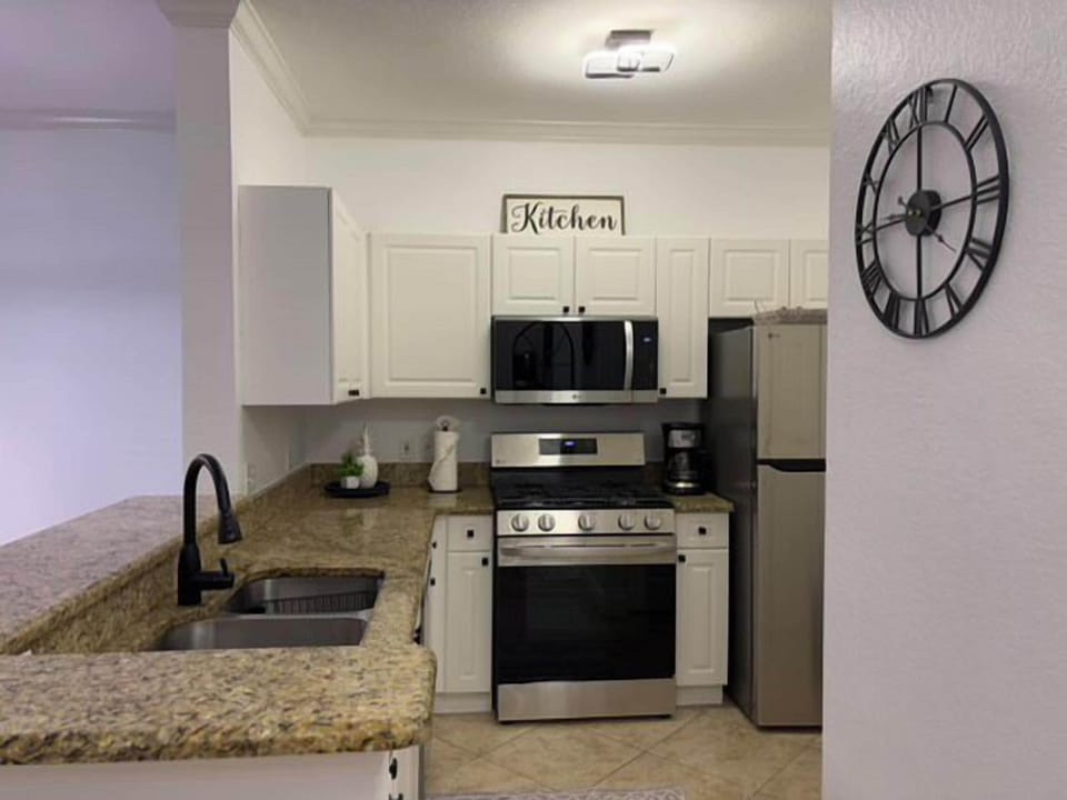 fully equipped kitchen with new stainless steel appliances