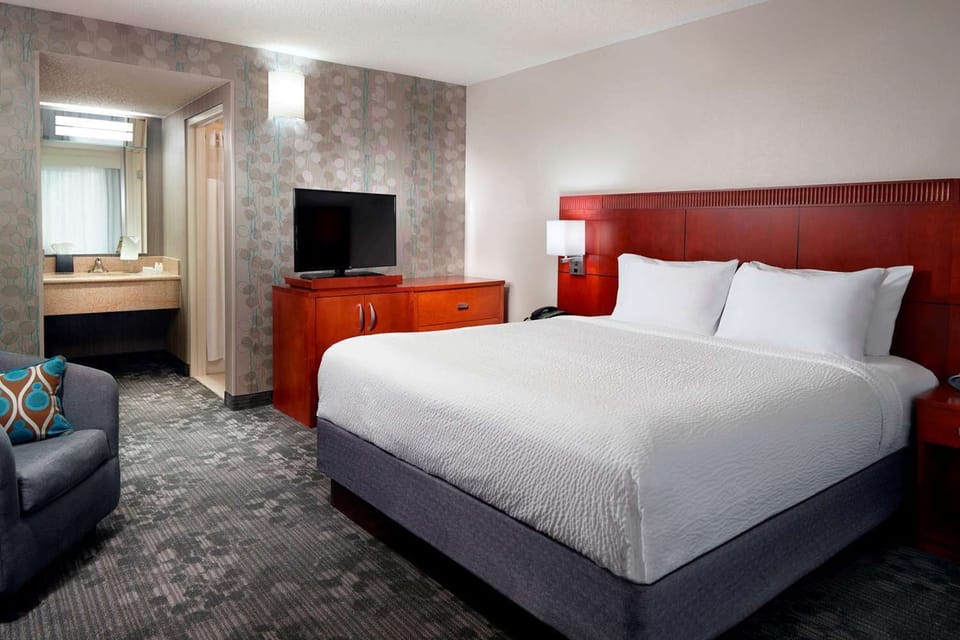 Unwind in a plush king bed after a busy day.