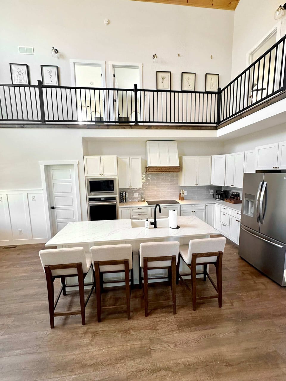 Elegant dining room with a spacious table, perfect for family meals, celebrations, or relaxed dining together.