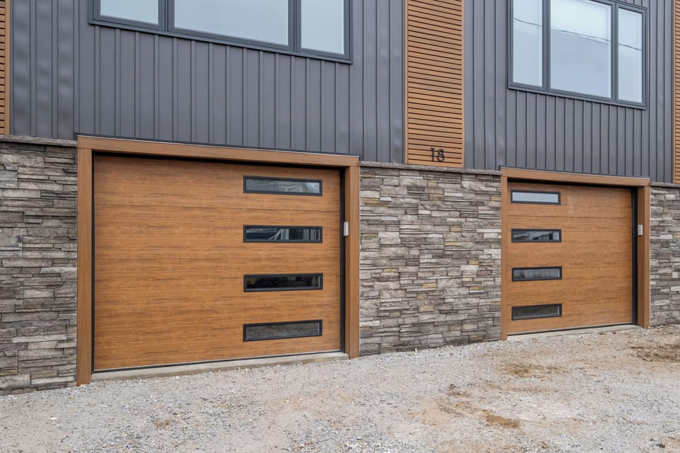 Unit A has the garage on the right side. You can fit two vehicles in the garage and one outside of the garage.