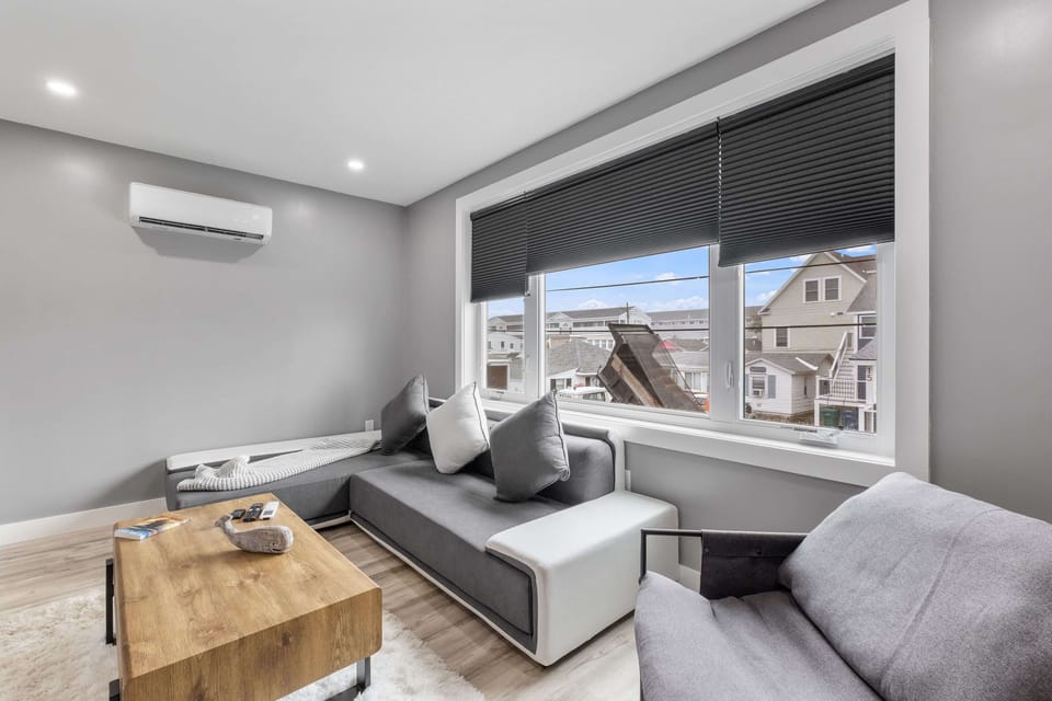 The living room is kept plenty comfortable anytime of year with a mini split. Mini splits can be found in every room and provide heat and AC.