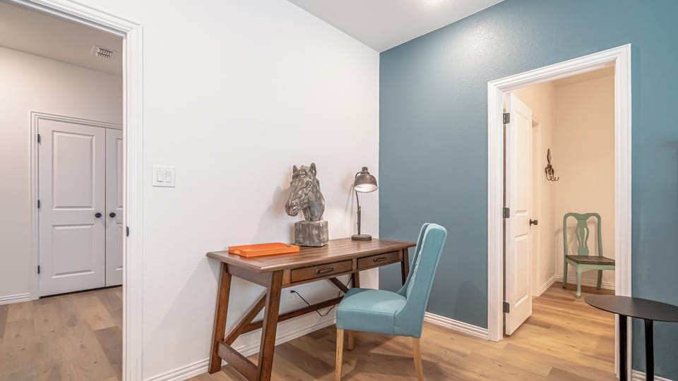 The bedroom is a serene retreat featuring a plush bed, soft linens, and warm lighting, creating the perfect space to relax and recharge.
