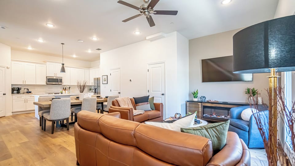 Kick back in a stylish, open-concept living space designed for comfort and connection. Whether you're debriefing after a Rangers game, watching pre-game coverage on the smart TV or just relaxing with your crew—The Ryan's living area has you covered.