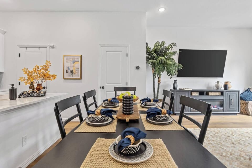 Dine in style in a beautifully appointed dining room with a large table and comfortable seating, ideal for memorable meals after a day of fun in Arlington's entertainment district.