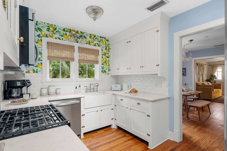 Bright kitchen with inviting wallpaper.