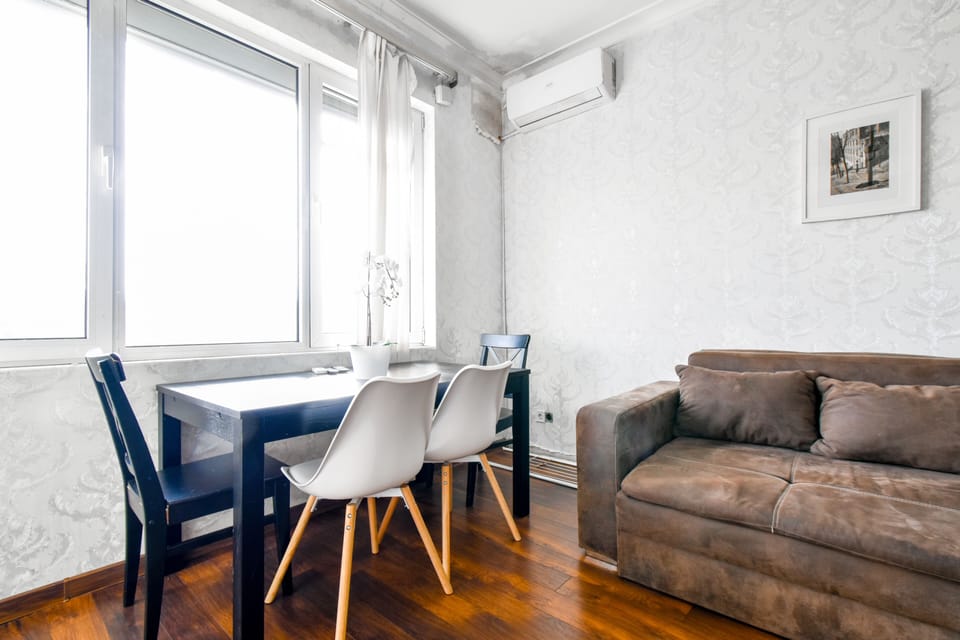 Bright and airy living area with stunning city views. Relax in style—check availability today!