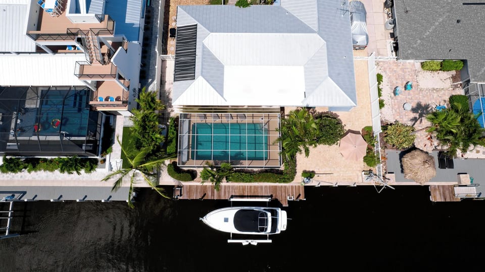 San Remo aerial - Screened in pool sits right off canal. 25ft boat dock.