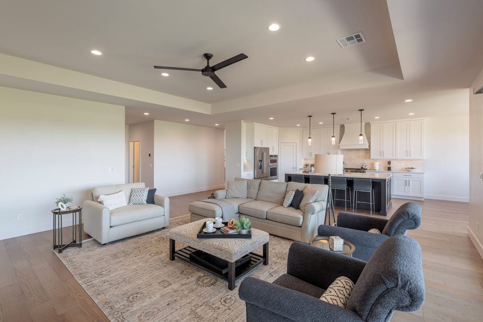 Living Area - The living room is designed as an open floor plan and is a great gathering place for meals, games, or watching TV during your stay.
