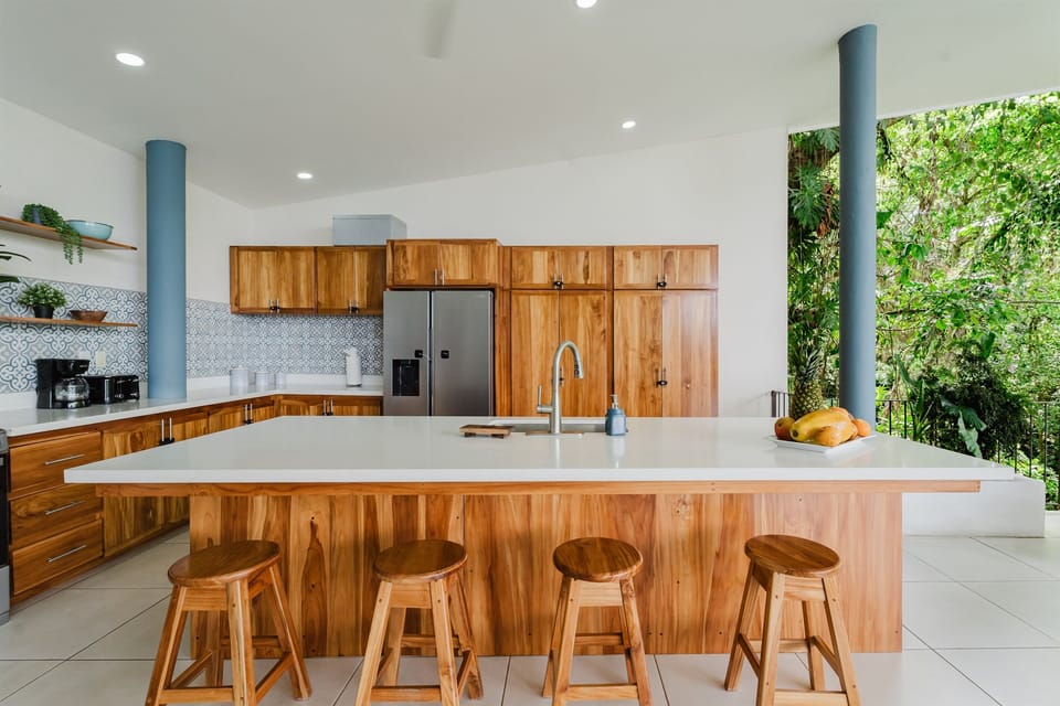 Warm wood finishes and premium appliances elevate the gourmet kitchen experience