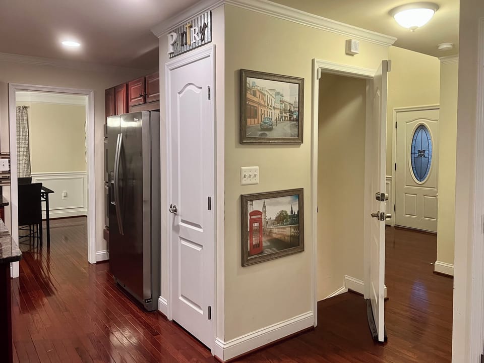 The lower level is accessible by the door near the pantry.