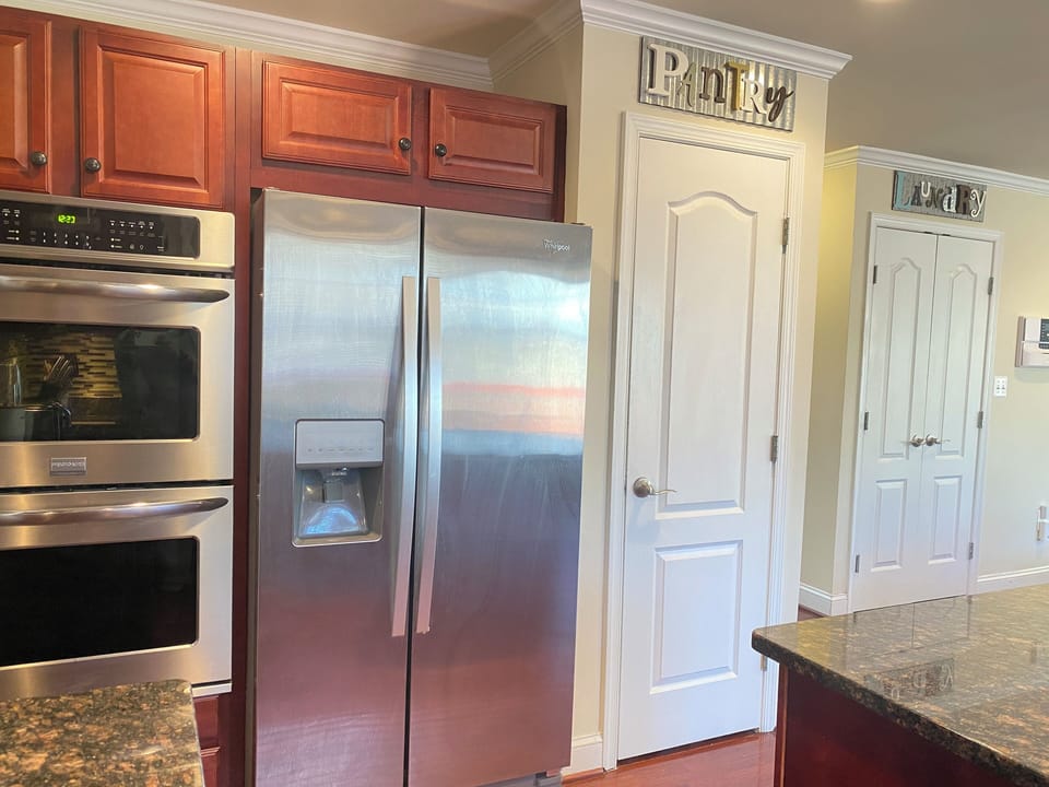 A full kitchen (microwave, refrigerator, dishwasher, stove, double ovens).