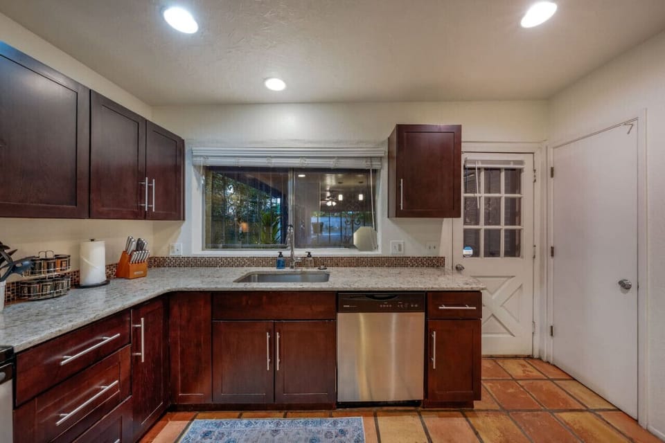 Updated, fully stocked and well-equipped kitchen with stainless steel appliances