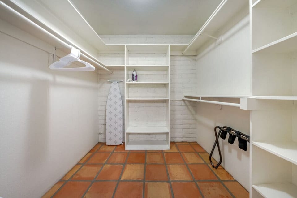 Primary bedroom`s spacious walk-in closet