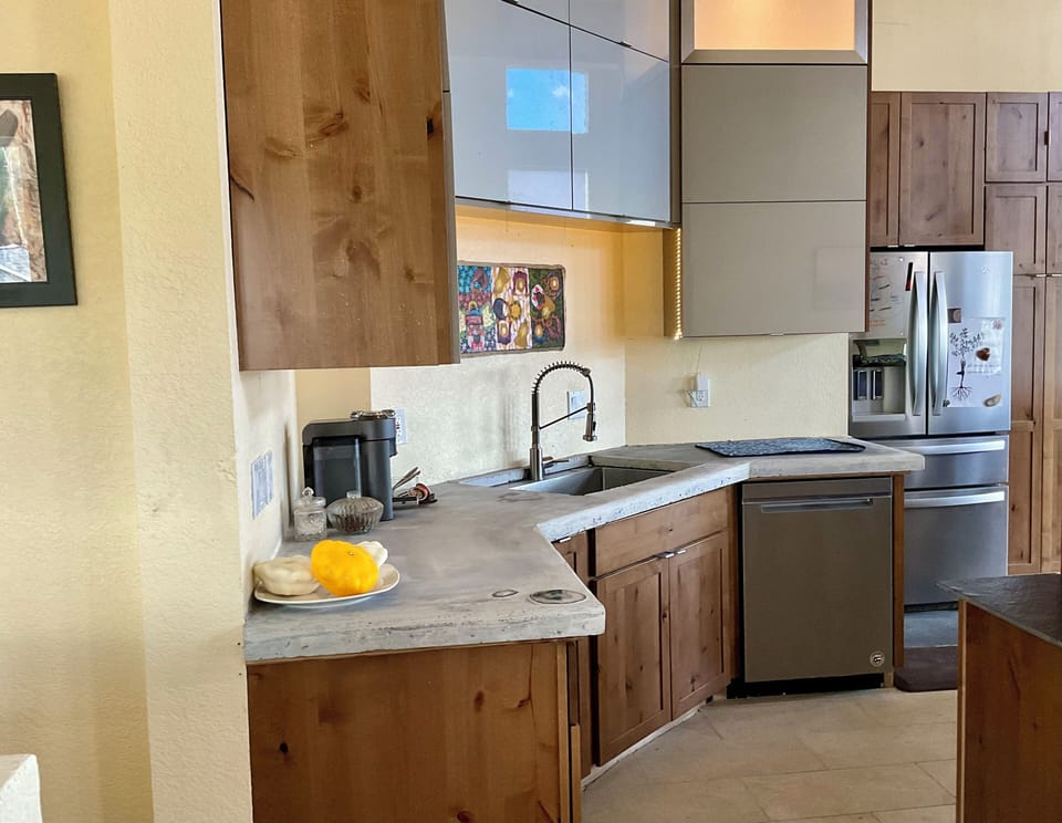 Coffee/ Tea station and sink with dishwasher.