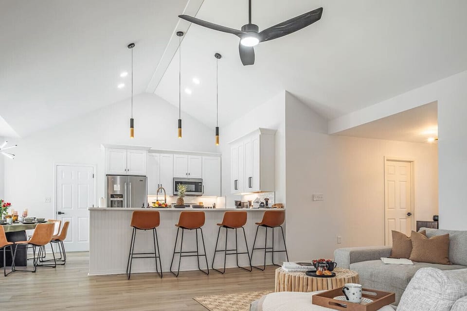 ✨ Modern comfort at Lotus Azul — open kitchen and living space with island seating, perfect for family gatherings.