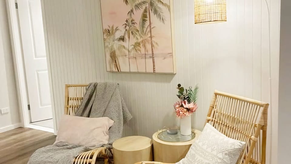 A little corner of calm—stylish sofas and statement lighting.