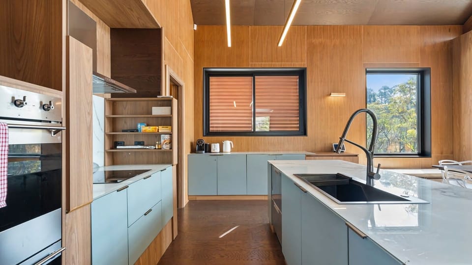 Well-appointed kitchen with oven, stovetop, dishwasher and essentials.