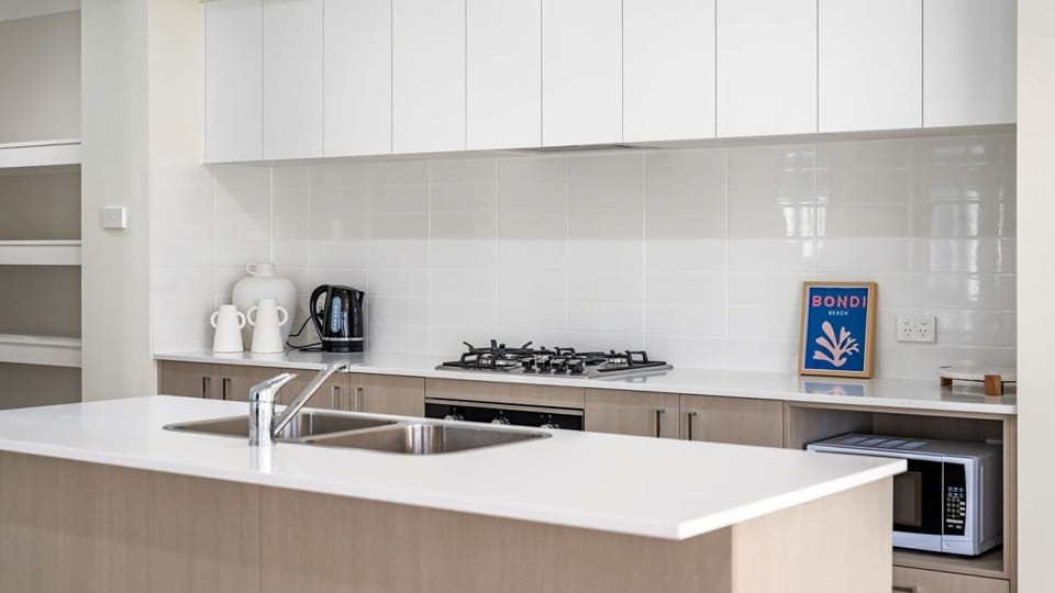 Bright and functional open-plan kitchen perfect for family meals.