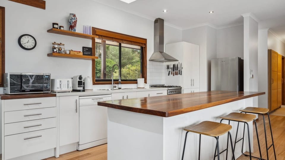 Well equipped kitchen featuring a spacious island with bar seating.