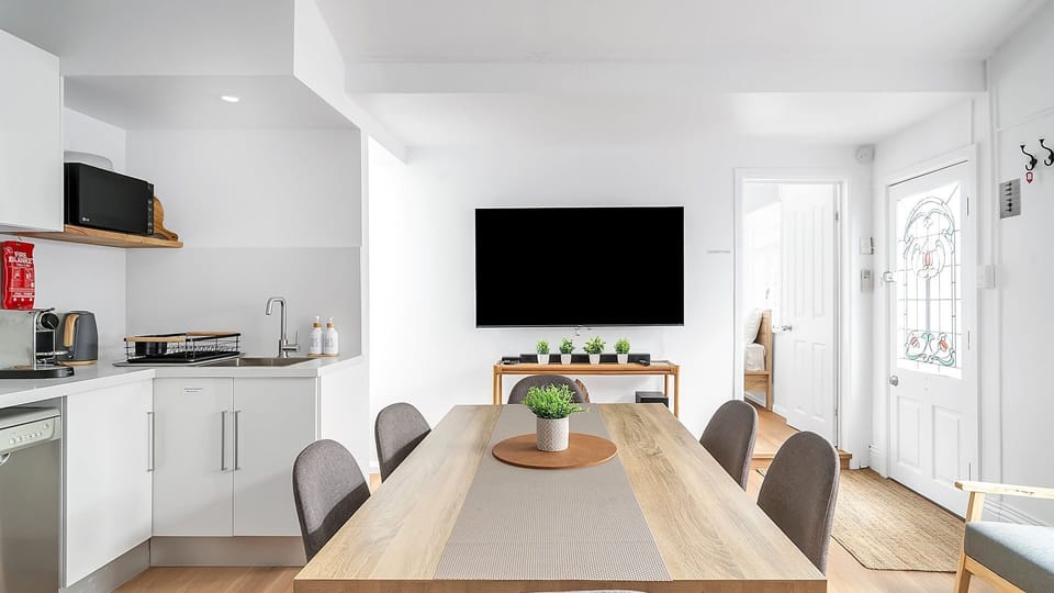Open living zone with seating, dining, and kitchen in one space.