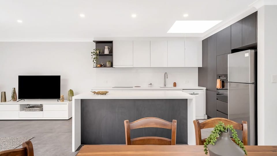 Kitchen island dreams. Sleek charcoal and crisp white.