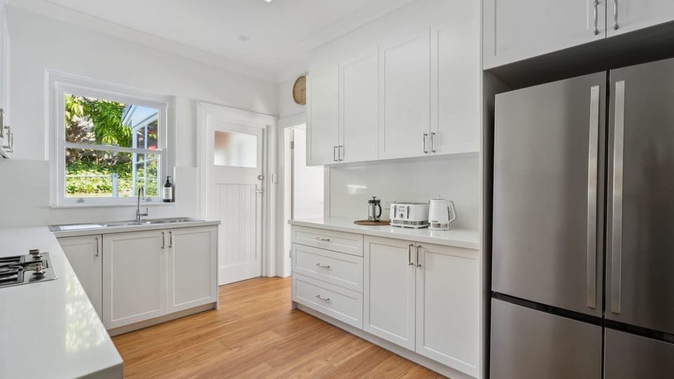 Well-equipped kitchen with gas cooking and modern appliances.