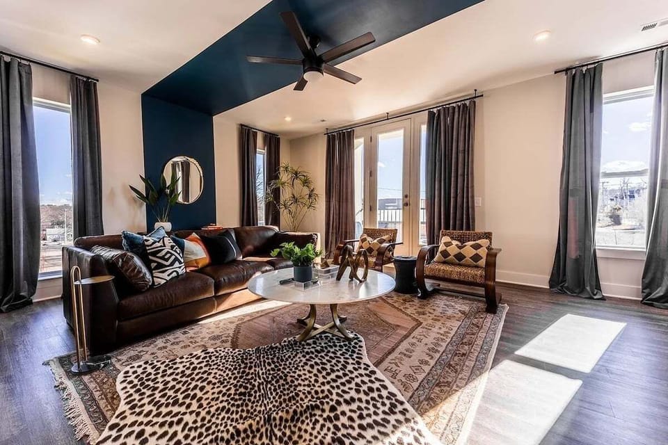 Open concept living area with comfortable seating and TV