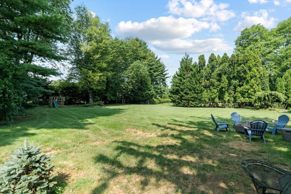 Lush Garden Retreat with Outdoor Seating and Play Area