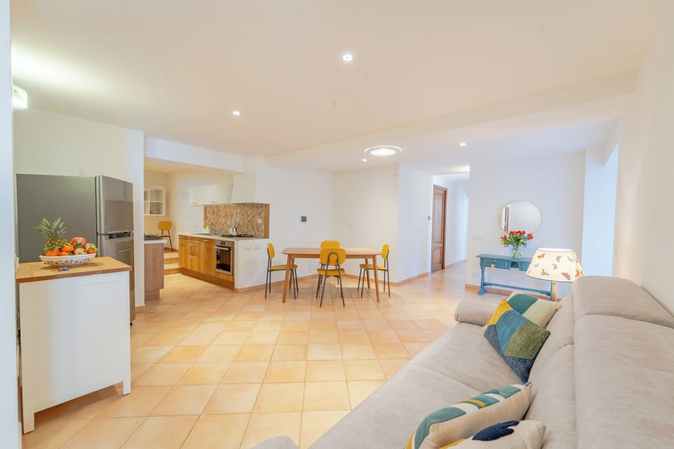 Open space with Tv, table, kitchen and sofa bed (double bed)