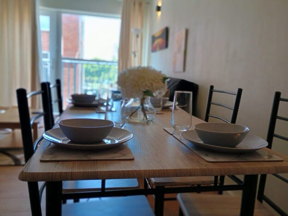 Gather in our elegant dining room, designed for comfort and style. It features a spacious dining table, perfect for enjoying meals with family and friends, and creating memorable dining experiences during your stay.