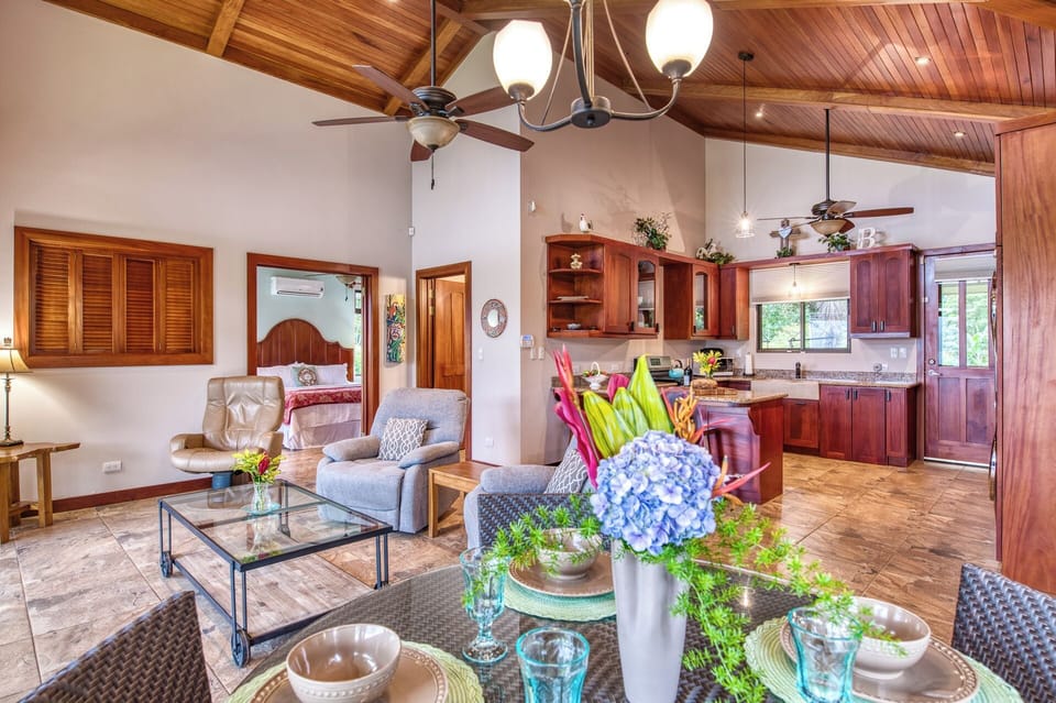The large common area with comfortable seating and dining area and a chef's kitchen.