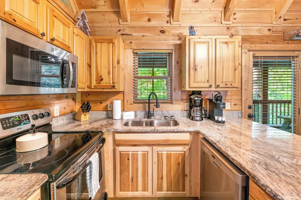 Kitchen with oven, microwave, and drip coffee maker