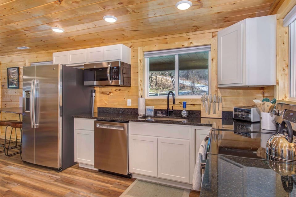 The open kitchen offers ample space & all the comforts of home