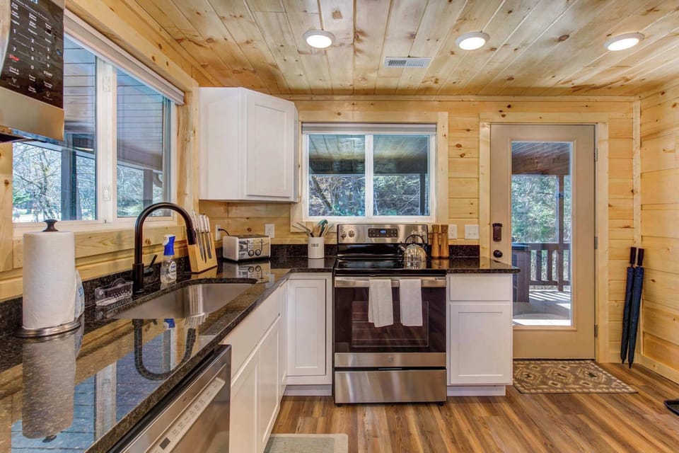 The open kitchen offers ample space & all the comforts of home