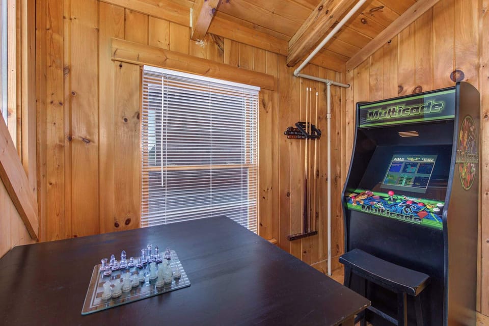The upper-level loft bedroom is ideal for gaming, with twin bunks & trundle!
