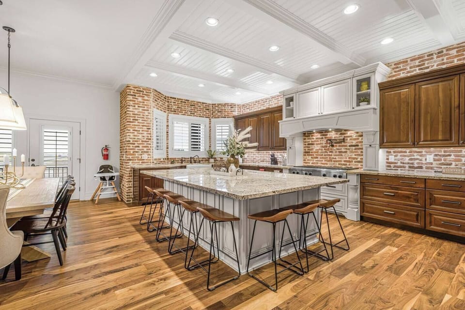 A dream kitchen for gathering, double islands, top appliances, and dining for 19.