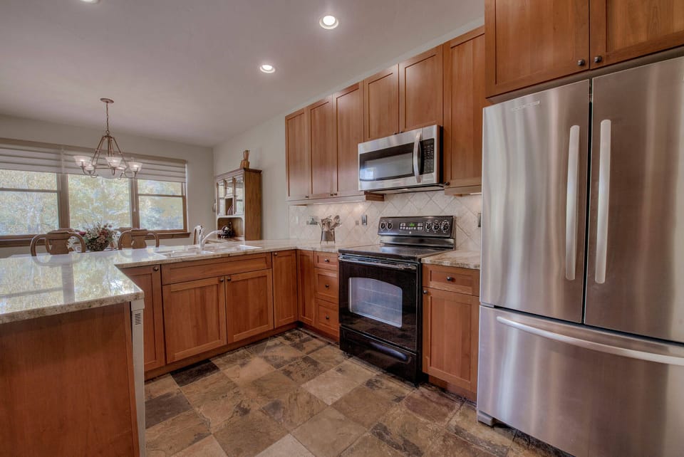 Kitchen with drip coffee maker, toaster, slow cooker, blender and more
