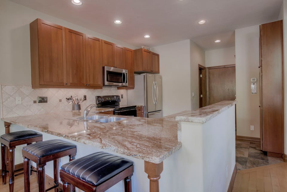 Kitchen with drip coffee maker, toaster, slow cooker, blender and more