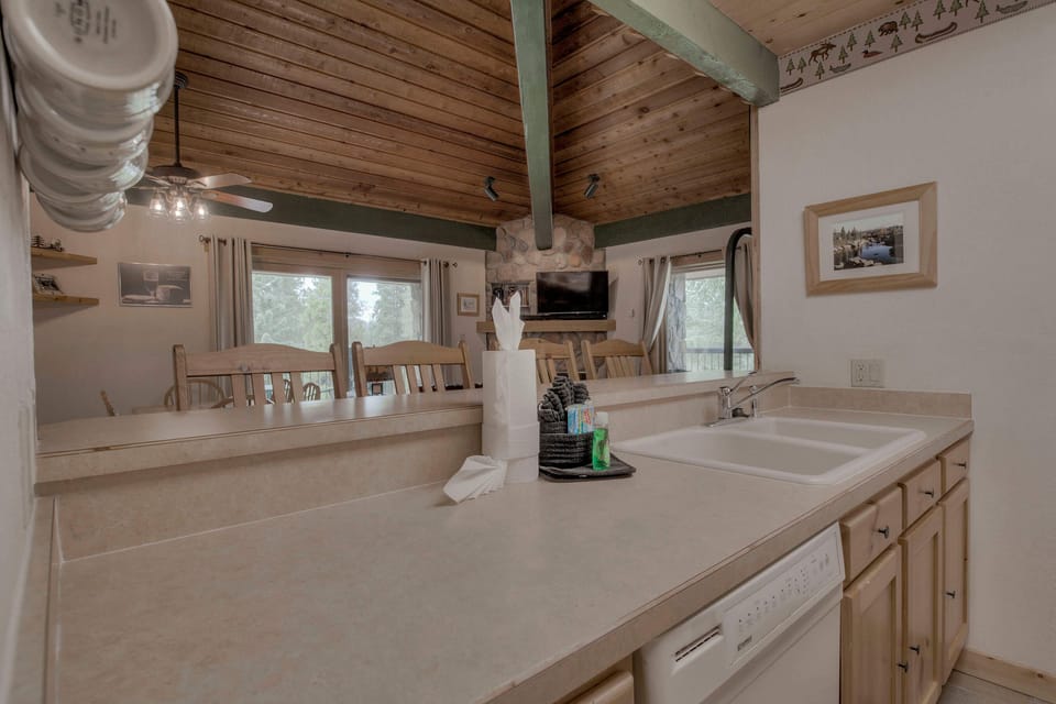Kitchen with toaster, drip coffee maker, blender, slow cooker, and more