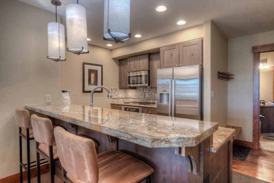 Kitchen with drip coffee maker, toaster, blender, slow cooker, and more