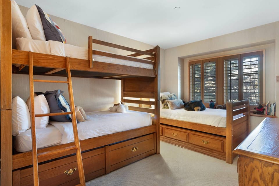 Bedroom 3 features a twin bunk bed with twin trundle bed and a single twin bed.